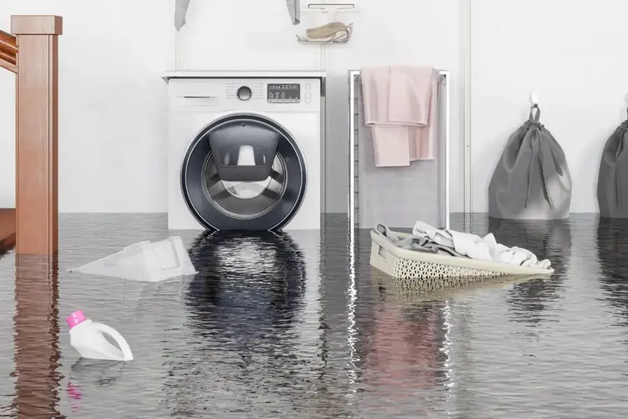 Flooded Natick laundry room from a failed appliance supply line